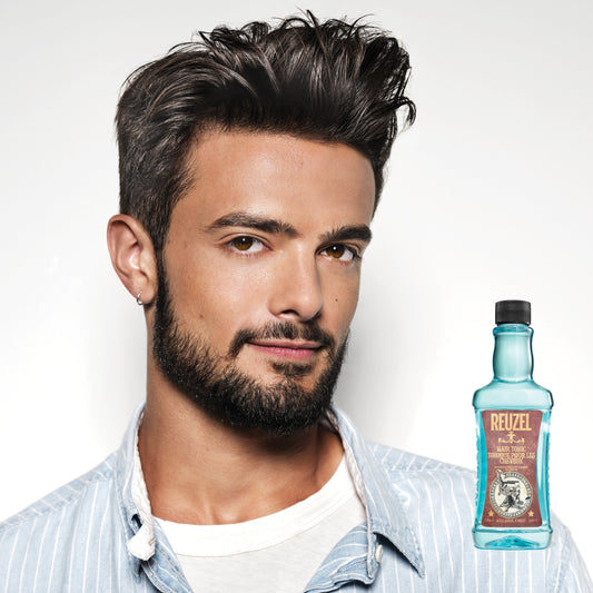 Man with brown hair styled with REUZEL Hair Tonic