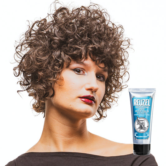 Woman with brown hair styled with REUZEL matte styling paste