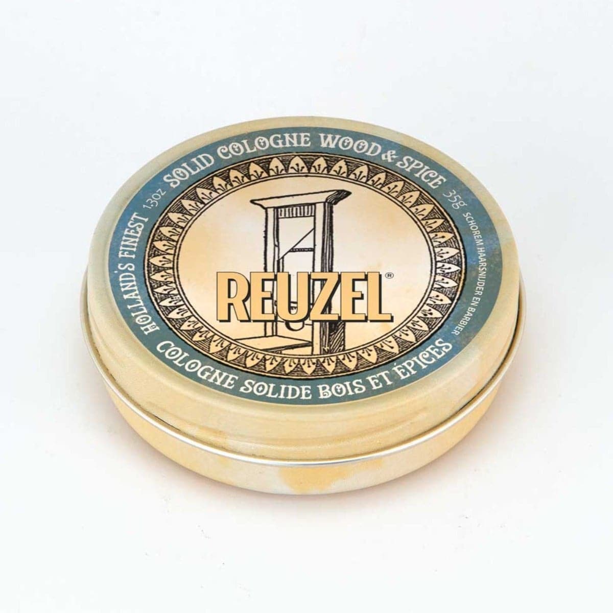 Reuzel Wood & Spice solid cologne balm in a tin container with warm wood and spice scent, ideal for on-the-go fragrance.