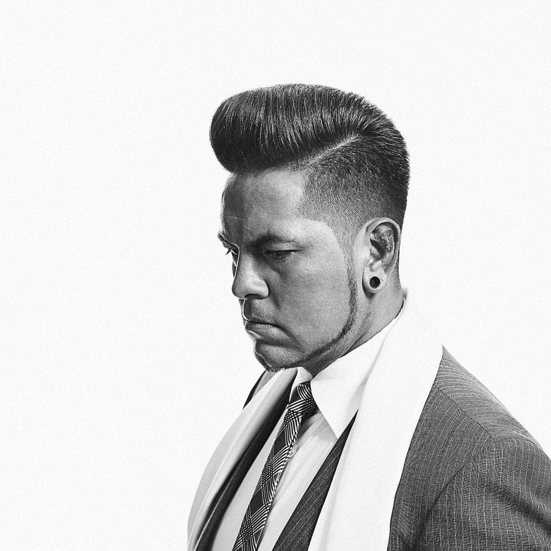 Man with healthy scalp and hair from routine use of lightweight spray tonics and traditional scalp-refreshing tonics.