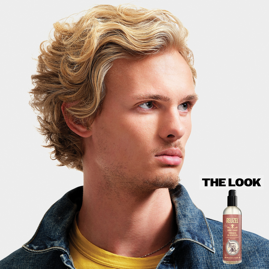 Blond model with wavy and textured hair, using Surf Tonic Salp Spray