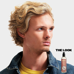 Blond model with wavy and textured hair, using Surf Tonic Salp Spray