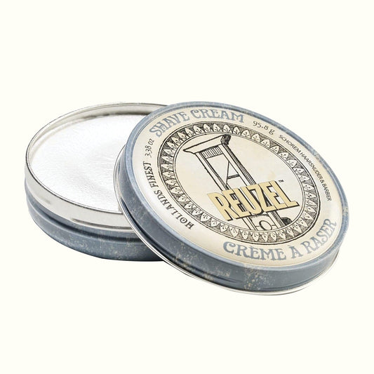 REUZEL shave cream tin shown as an example of a moisturizing shaving cream for sensitive skin