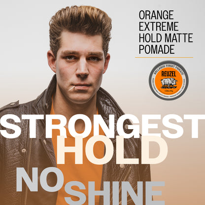 Promotional graphic for REUZEL Strongest Hold Matte Pomade, featuring a young man with styled brown hair wearing a leather jacket over an orange shirt. Large text reads 'STRONGEST HOLD NO SHINE' and 'ORANGE EXTREME HOLD MATTE POMADE' 