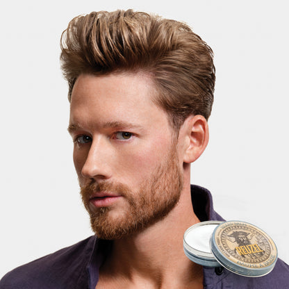 Man with brown hair and beard styled with REUZEL beard balm 