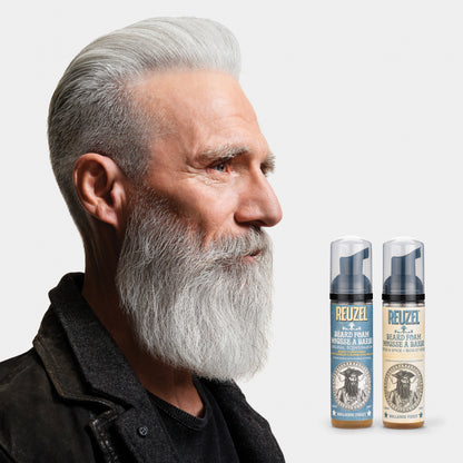 Man with a gray beard styled with REUZEL beard foam