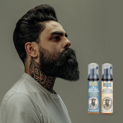 Man with brown hair and beard styled with REUZEL beard balm 