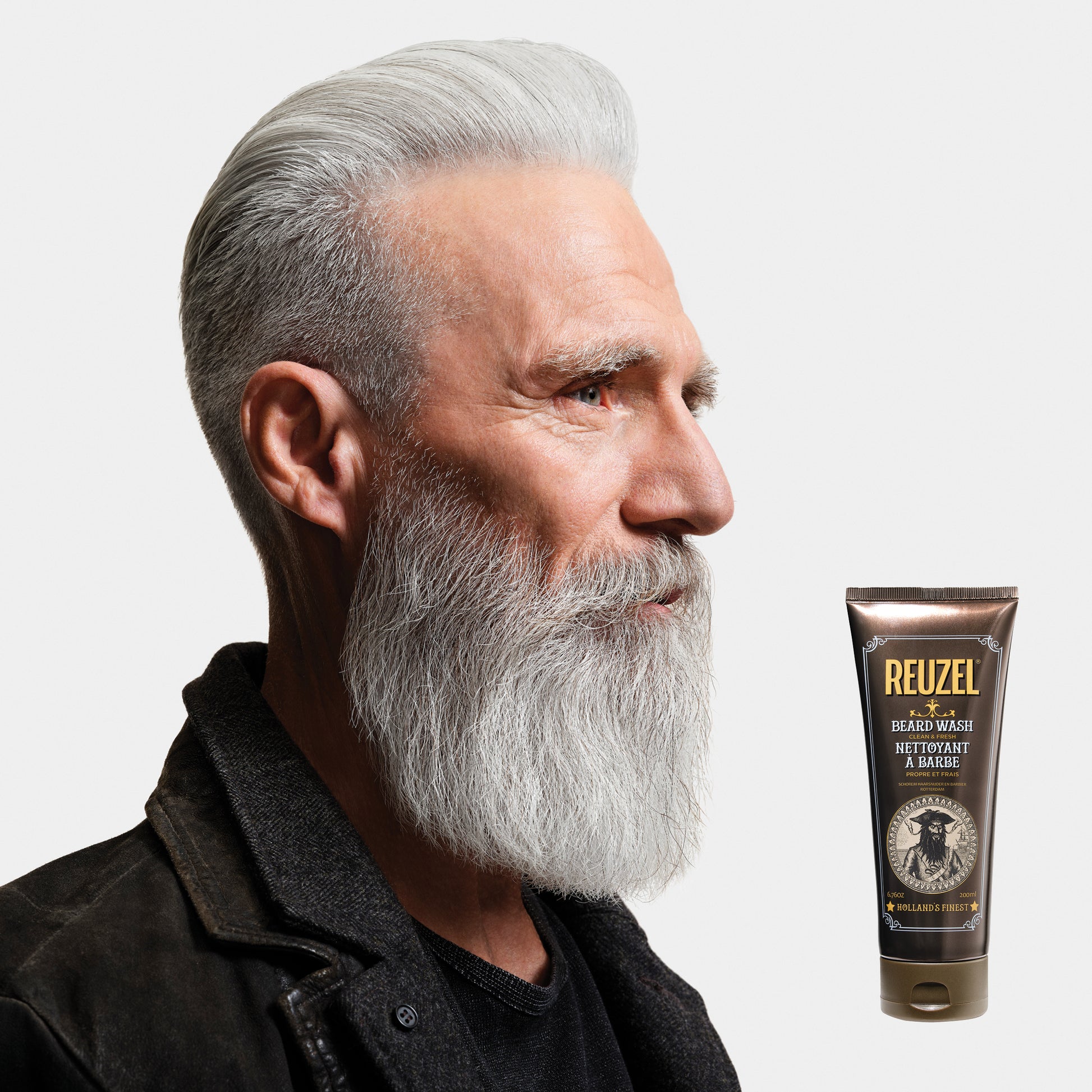 MAN WITH BEARD WASHED WITH REUZEL Beard Wash