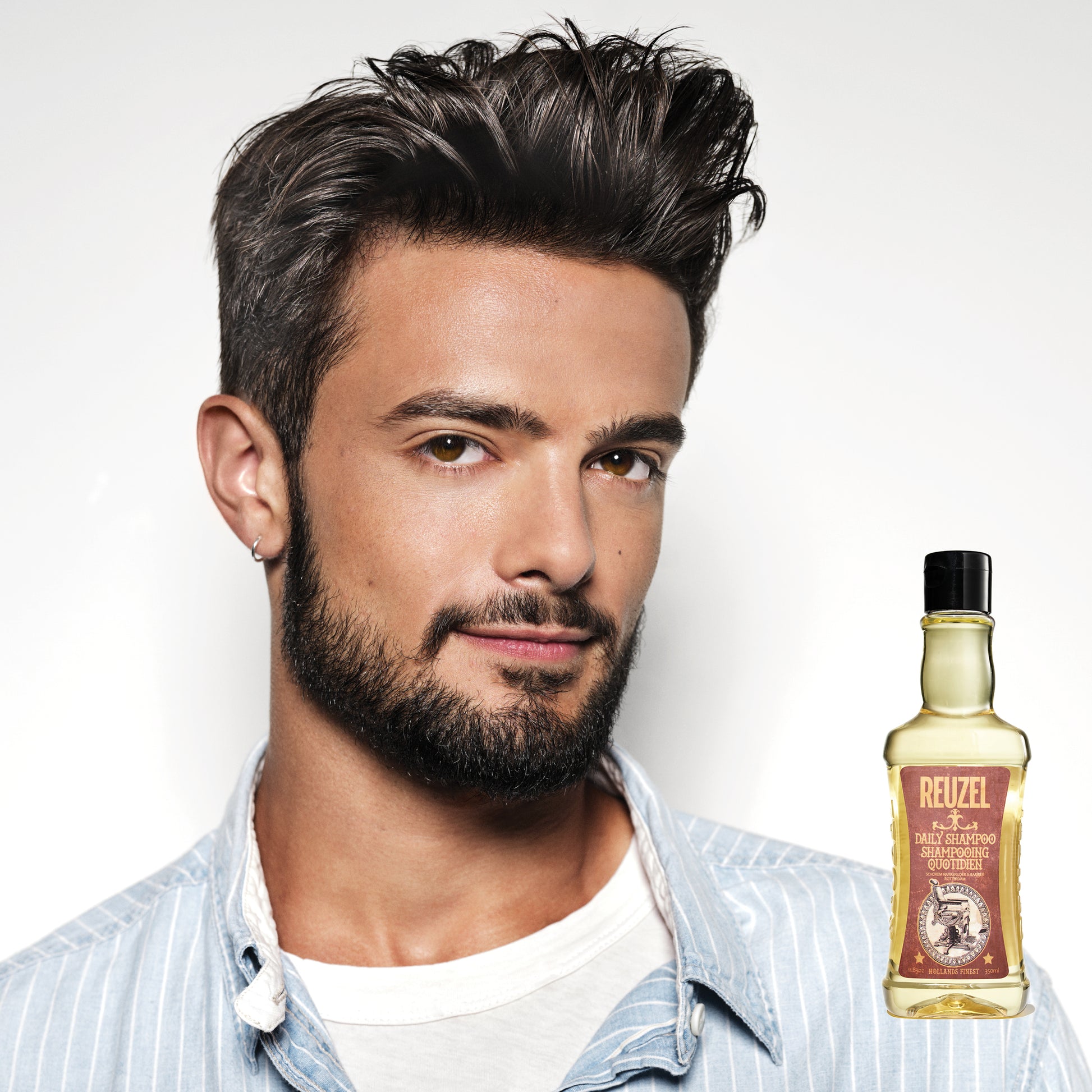 Man with brown hair styled with REUZEL Daily Shampoo