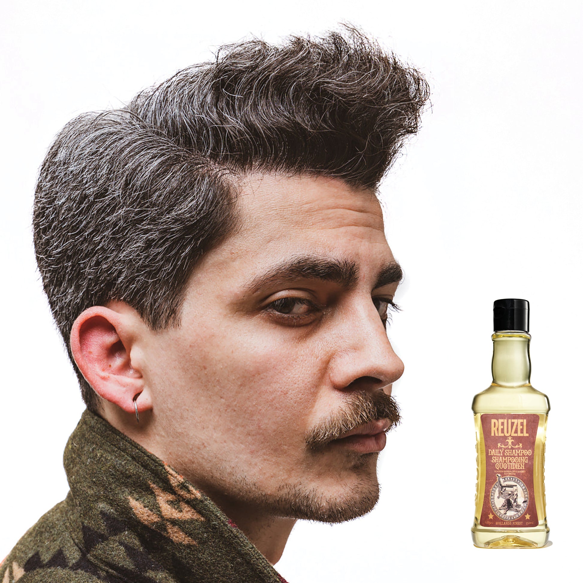 Man with brown hair styled with REUZEL Daily Shampoo