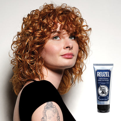 Woman with red hair styled with REUZEL Fiber Cream