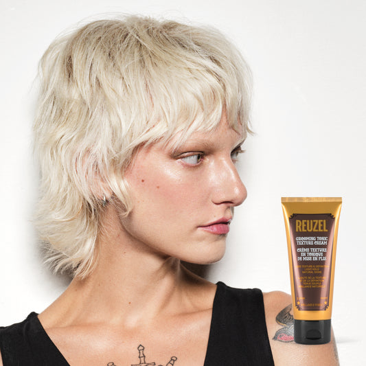 Woman with blonde hair styled with  REUZEL Grooming Tonic Texture Cream 