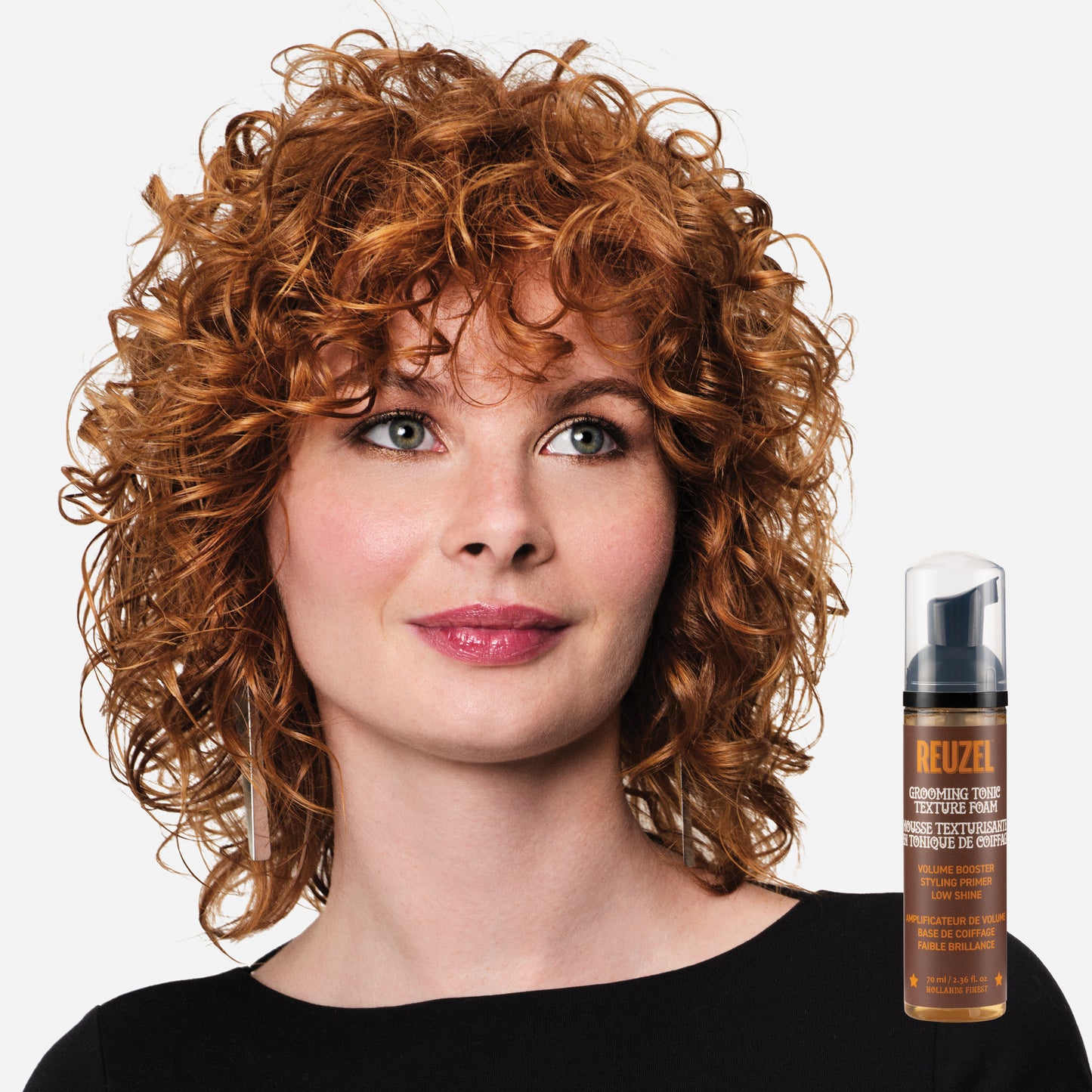 Woman with red hair styled with REUZEL Grooming Texture Foam