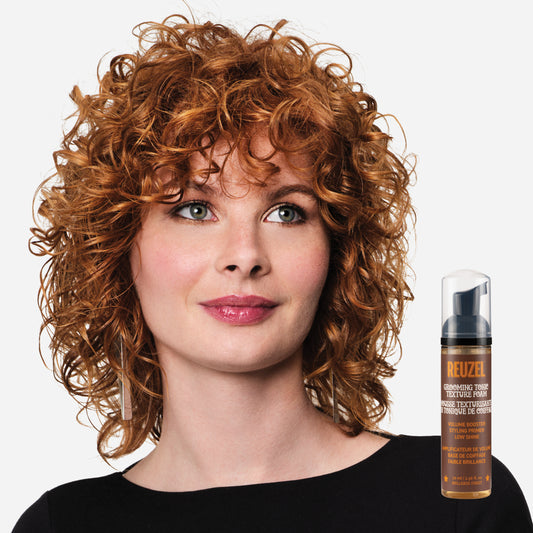Woman with red hair styled with REUZEL Grooming Texture Foam