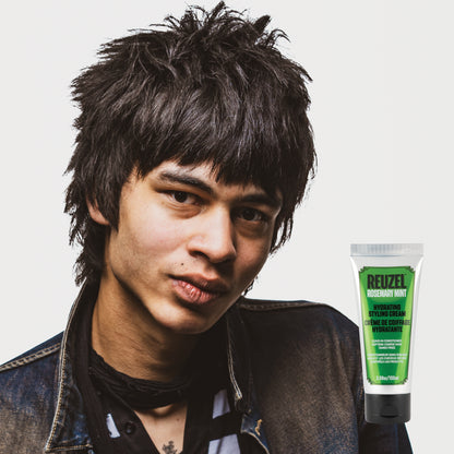 Man with black hair styled with REUZEL Rosemary Mint Hydrating Styling Cream 