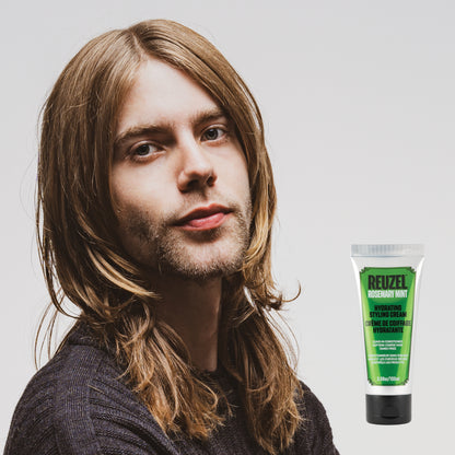 Man with brown hair styled with REUZEL Rosemary Mint Hydrating Styling Cream 