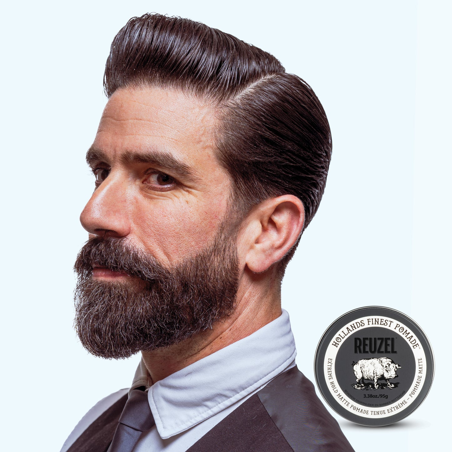 Man with brown hair styled with Extreme Hold Matte Pomade by REUZEL