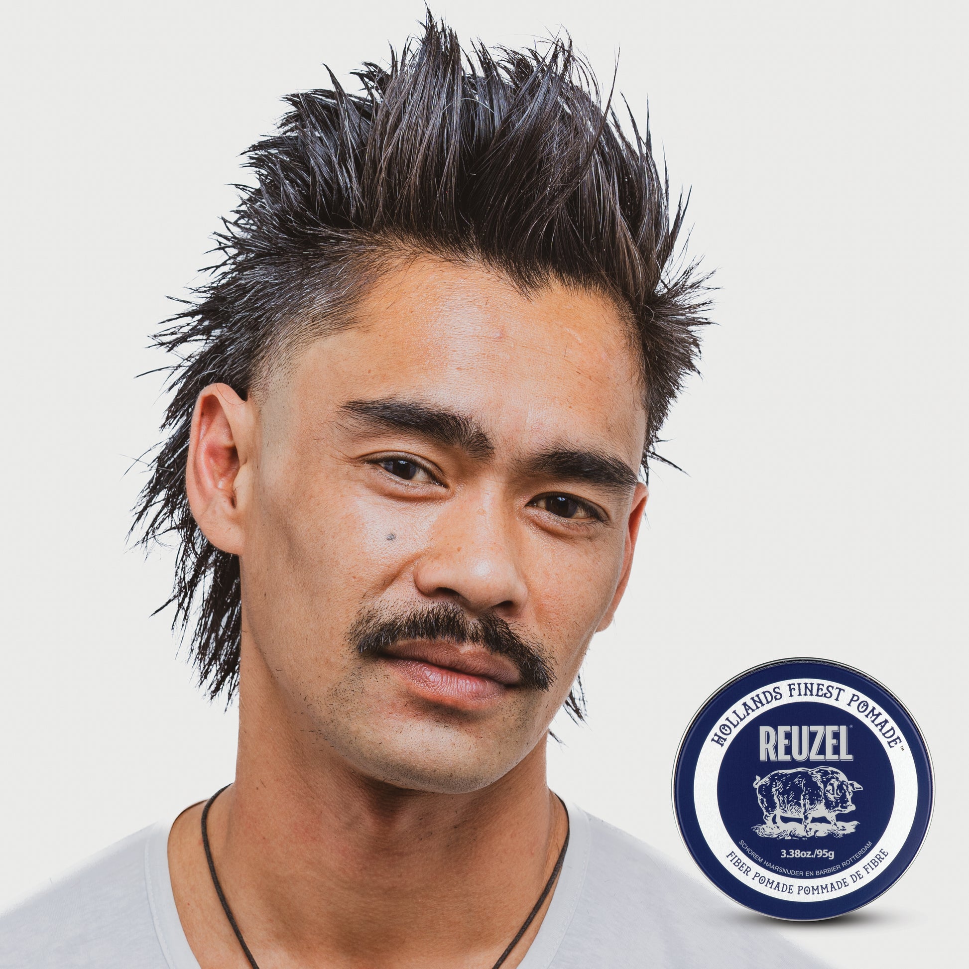 Man With Brown Piecey Hair Styled with REUZEL Fiber Pomade