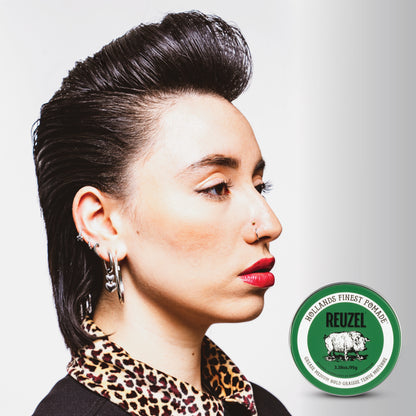  Woman with black hair styled with REUZEL grease medium hold pomade.