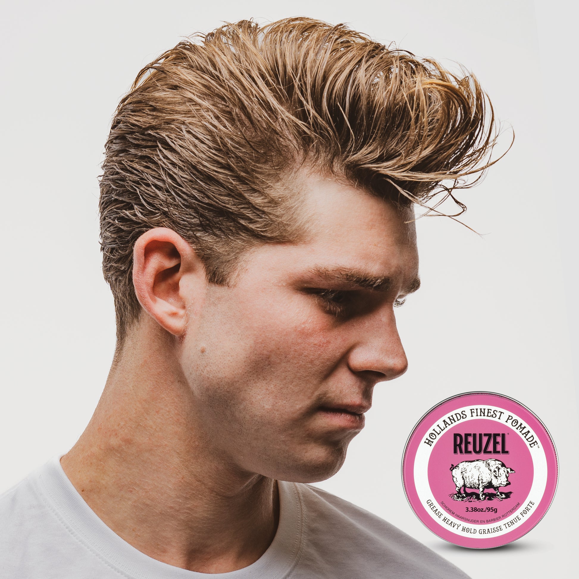 Man with brown hair styled with REUZEL Pink Grease Heavy Pomade