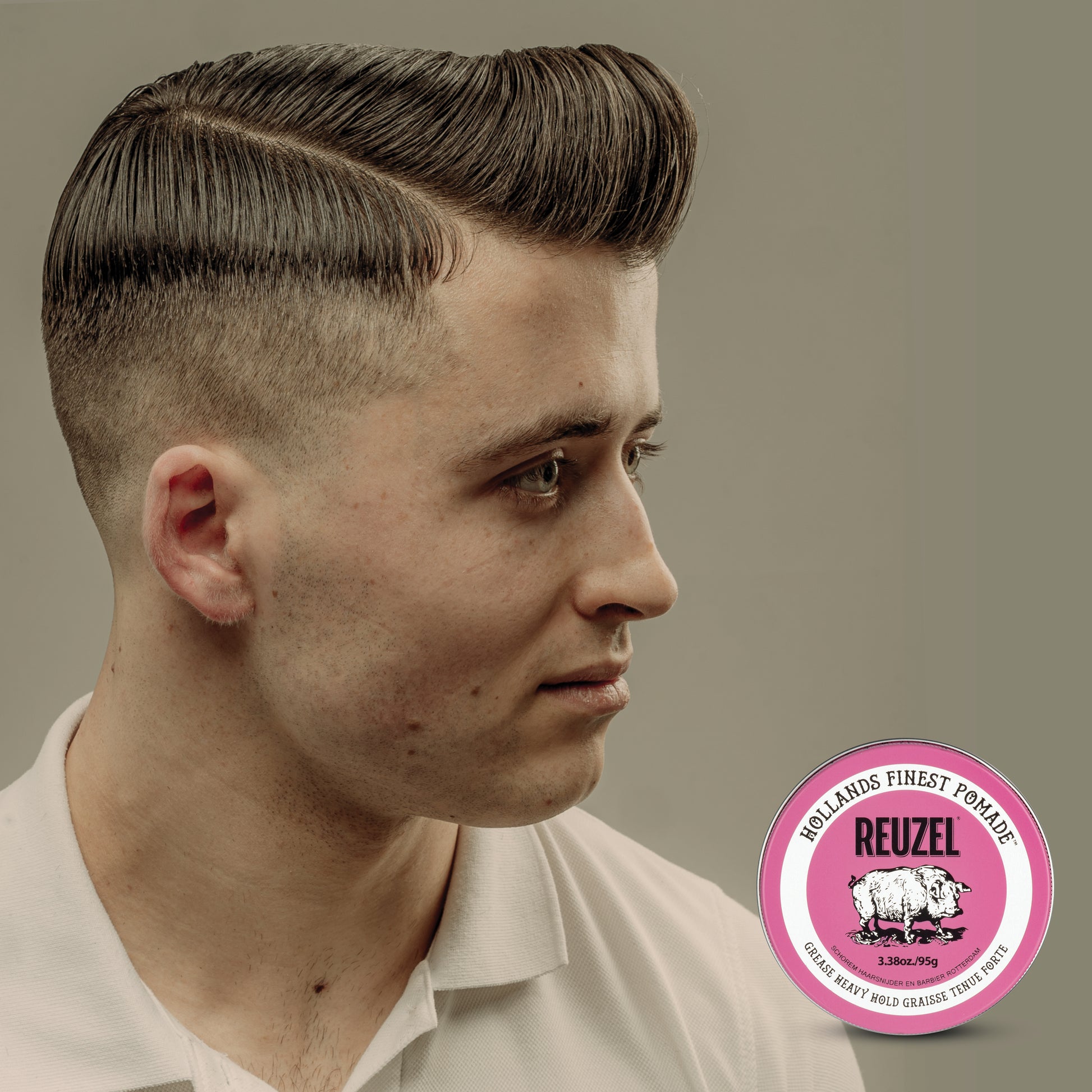 Man with brown hair styled with REUZEL Pink Grease Heavy Pomade