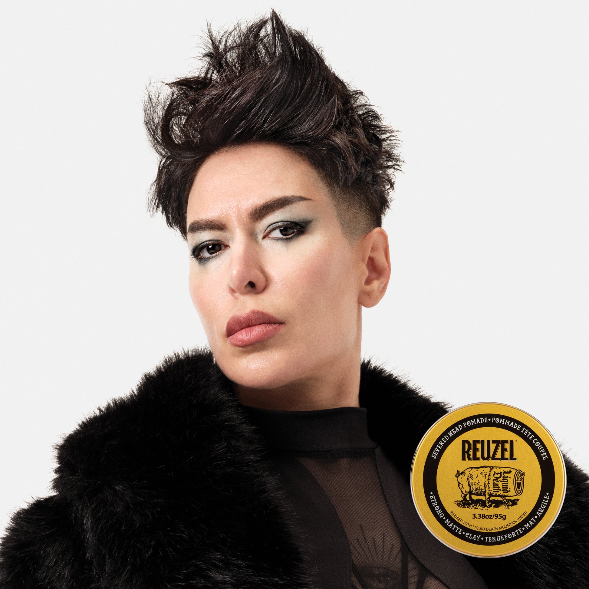 Woman's hair styled with REUZEL Severed Head Strong Hold Matte Clay Pomade