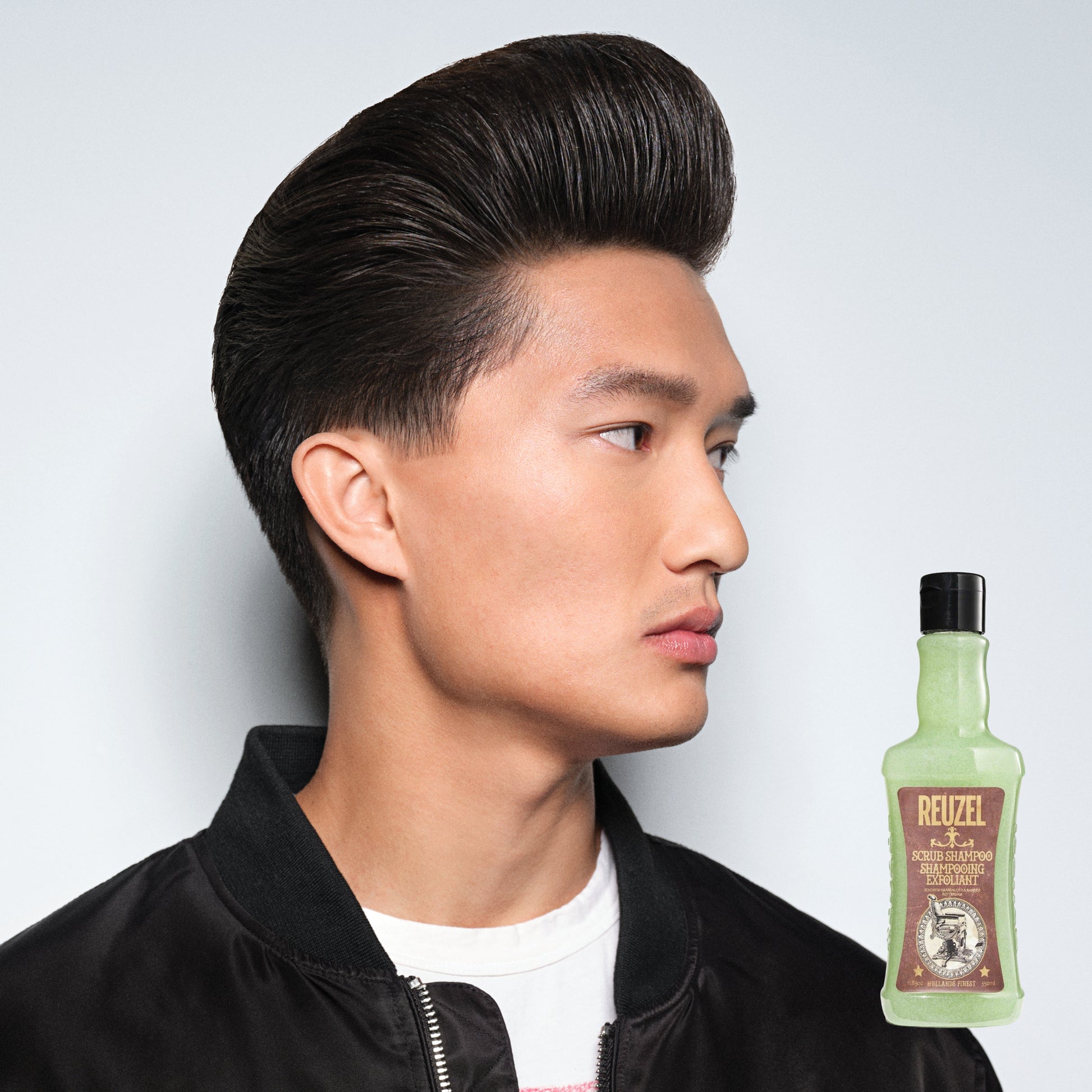 Man with brown hair styled with REUZEL Scrub Shampoo