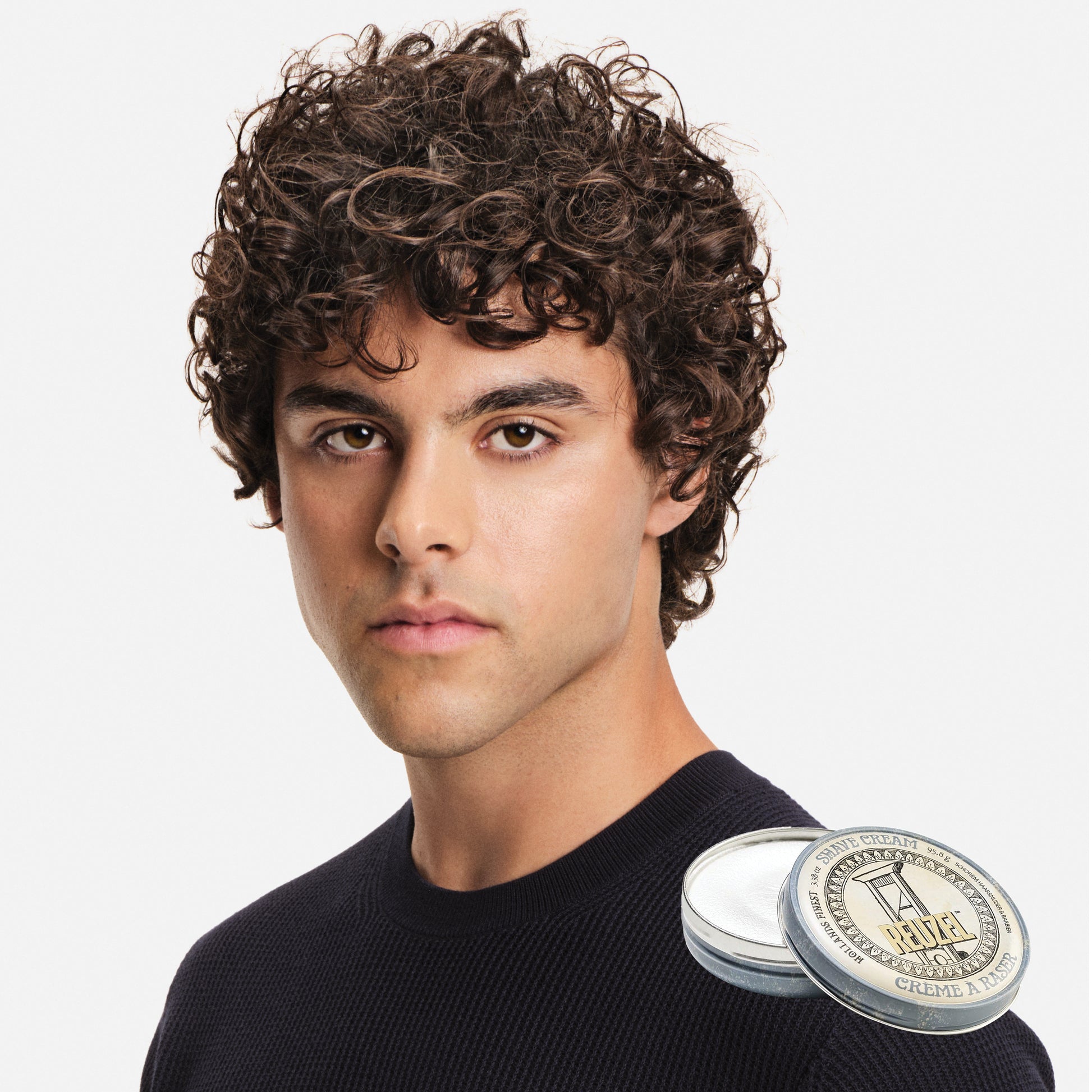 MAN WITH Cleanly shaved face using REUZEL Shave Cream