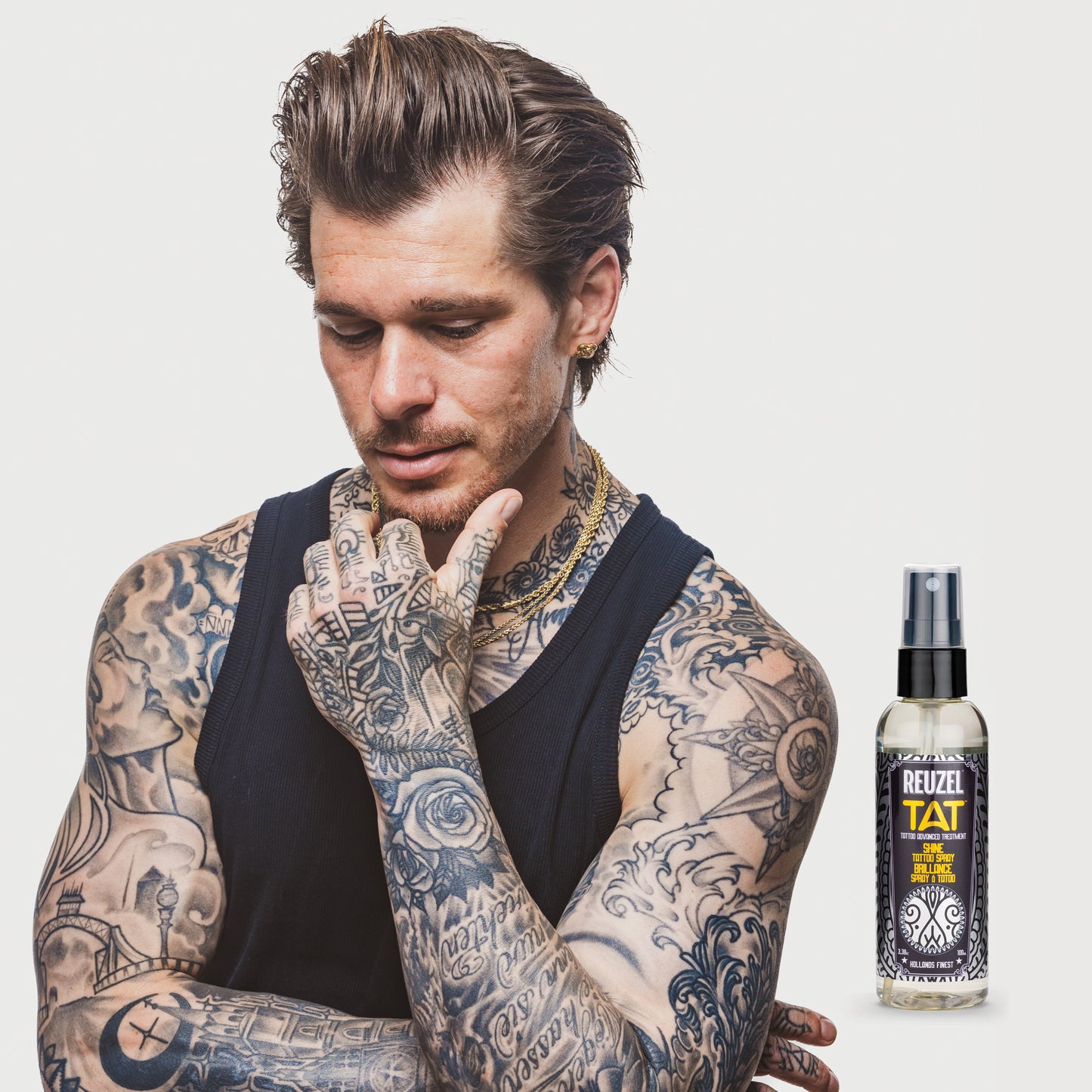 Man with vibrant shiny tattoos used with REUZEL TAT SHINE Spray Tattoo Aftercare Products