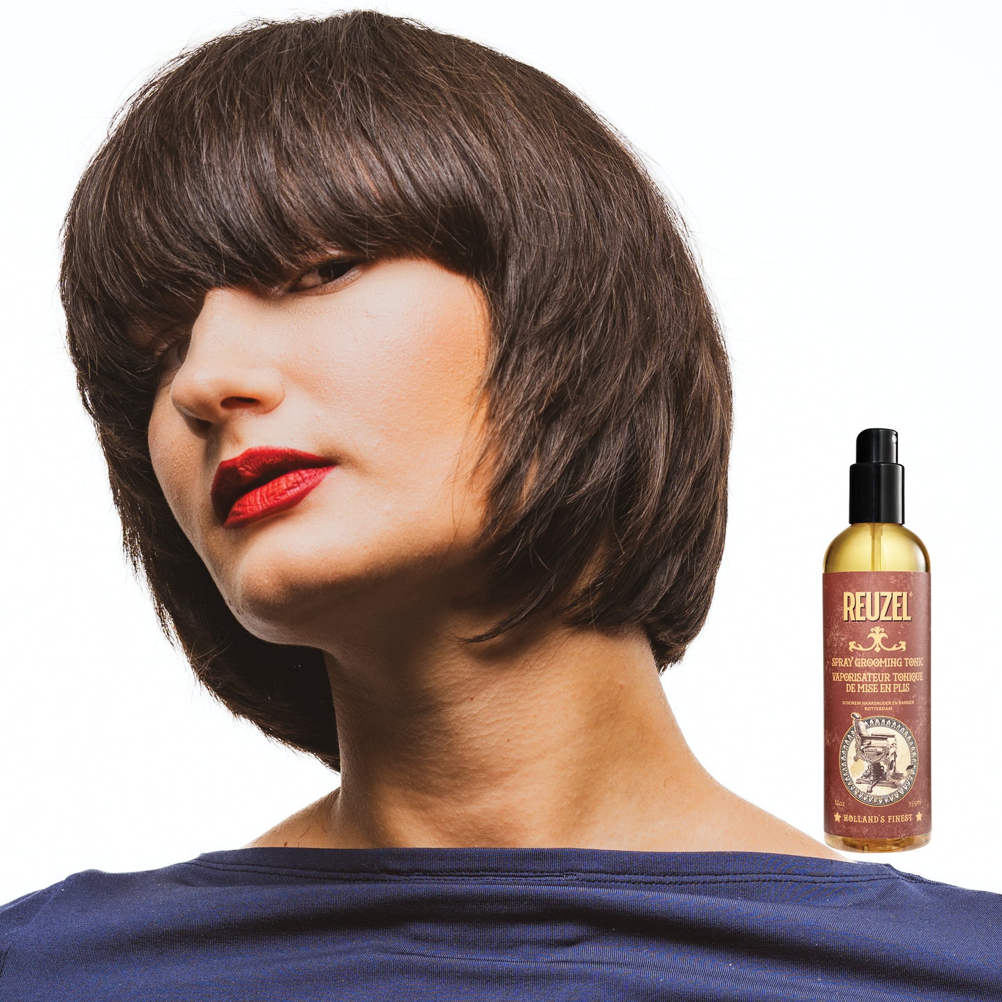 Woman with brown hair styled with REUZEL Spray Grooming Tonic