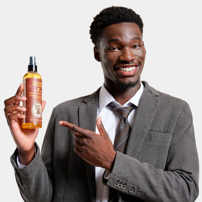 Man with brown curly textured hair styled with REUZEL Spray Grooming Tonic