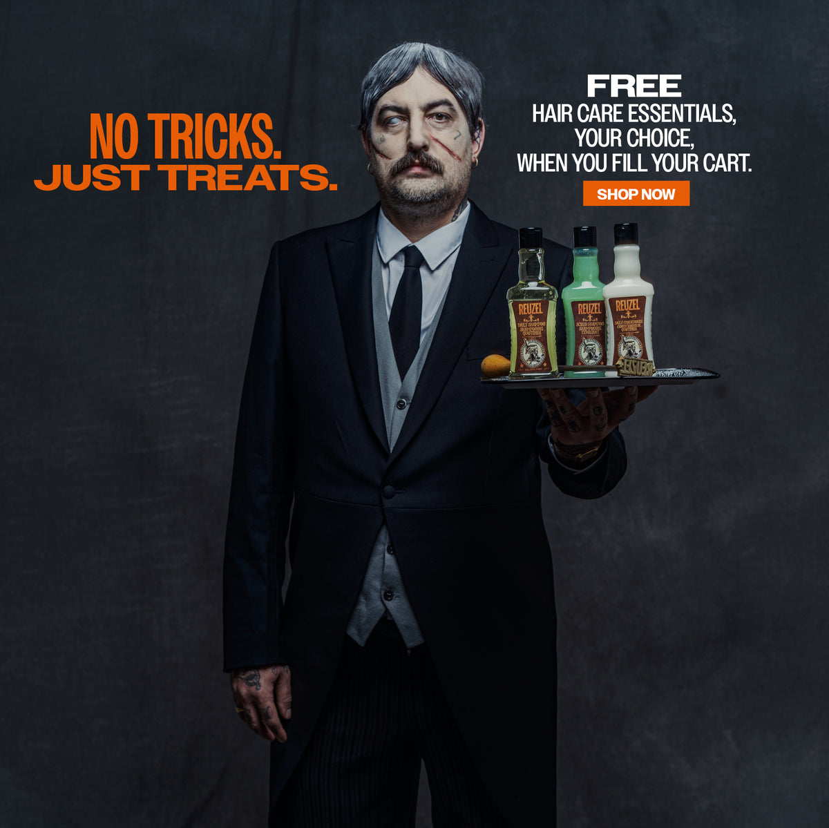 REUZEL promotional banner. "No tricks. Just treats. FREE hair care essentials, your choice, when you fill your cart." "SHOP NOW" click to shop now